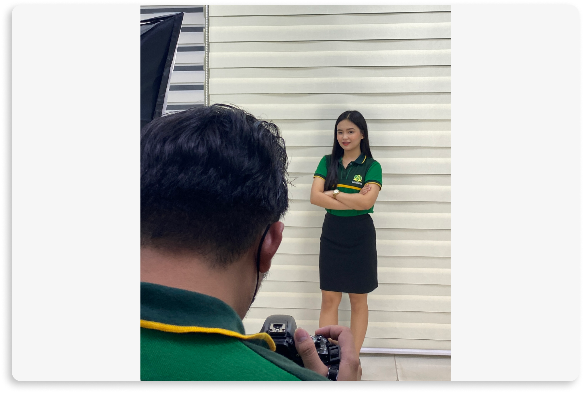 Aljoy in her photo shot standing wearing her Agribank office uniform.